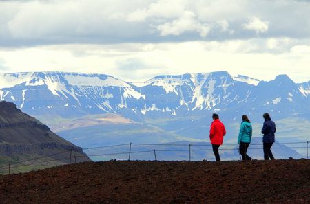 BorgarfjÃ¶rÃ°ur, Iceland - June 22, 2019 - People enjoying the view of the snowy mountains near Grabok Crater during the summerのeditorial素材