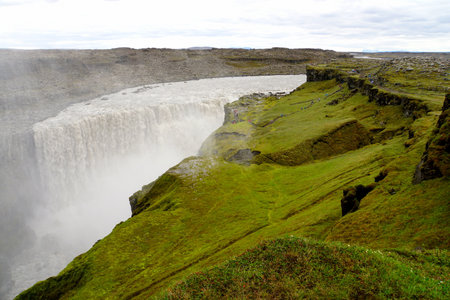 Beautiful view of Dettifoss, a waterfall in Vatnajokull National Park in Northeast Iceland during the summerの写真素材