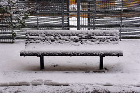 A bench covered with ice after a snowstorm near Philadelphia, Pennsylvania, U.Sの写真素材