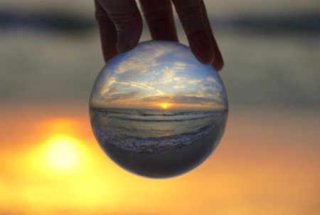 Beautiful sunset captured through a lens ball at Madeira Beach, Florida, U.Sの写真素材
