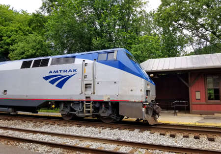 Harpers Ferry, Virginia, U.S.A - June 19, 2021- An Amtrak train stopped by the railway station