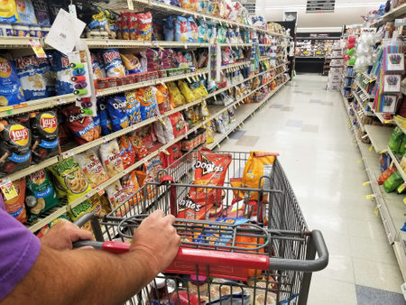 Wilmington, Delaware, U.S.A - September 7, 2021 - Pushing a cart on the snacks aisle inside a grocery shopのeditorial素材