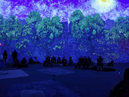 Upper Darby, Pennsylvania, U.S.A - November 28, 2021 - The large colorful projected display of Van Gogh arts on the wallのeditorial素材