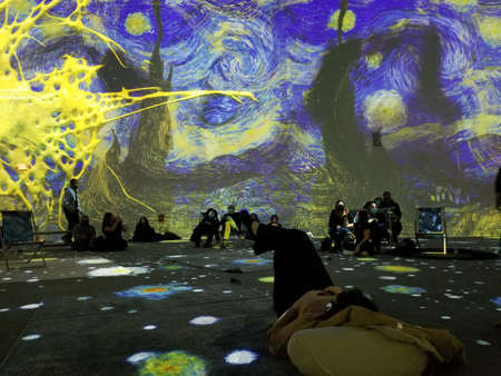 Upper Darby, Pennsylvania, U.S.A - November 28, 2021 - The large colorful projected display of Van Gogh arts on the wallのeditorial素材