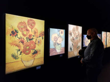 Upper Darby, Pennsylvania, U.S - November 28, 2021 - Visitors enjoying the bright color display of Van Gogh arts on the wallのeditorial素材