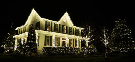 A residential home decorated in Christmas lights in Nottingham, Pennsylvania, U.S.Aの写真素材