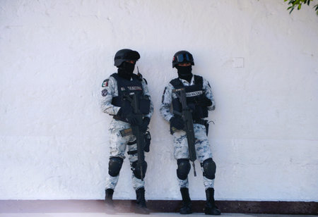 Puerto Vallarta, Mexico - November 9, 2022 - Two National Guards standing on the streetのeditorial素材