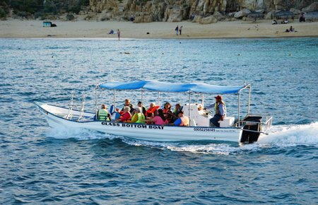 Cabo San Lucas, Mexico - November 7, 2022 - The Glass Bottom boat moving on the bay overlooking the Lover's Beachのeditorial素材