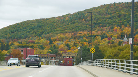 Corning, New York, U.S.A - October 18, 2022 - The road into downtown with the background of fall...