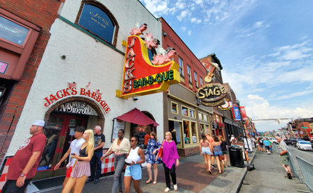 Nashville, Tennessee, U.S - June 26, 2022 - The crowds walking along the street with bars and restaurantsのeditorial素材