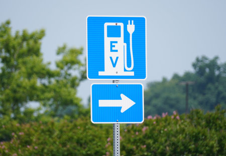Rehoboth Beach, Delaware, U.S.A - June 18, 2023 - The blue and white EV sign for the charging station for electric vehiclesのeditorial素材
