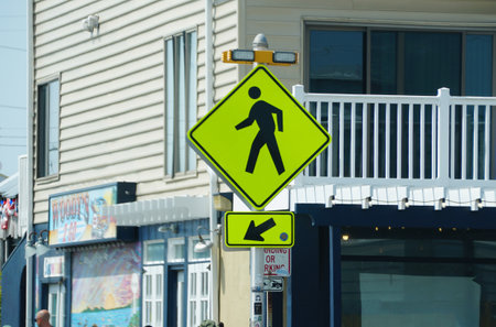 Dewey Beach, Delaware, U.S - July 8, 2023 - A yellow crossing line and blinking lights on the streetのeditorial素材