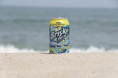 Savage Ditch, Delaware, U.S.A - August 5, 2023 - A can of Brisk Ice Tea on the beach