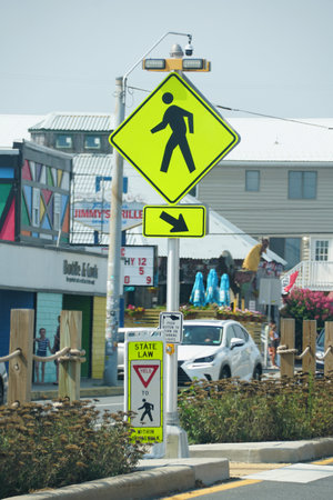 Dewey Beach, Delaware, U.S - August 5, 2023 - A yellow crossing line with blinking lights on the streetのeditorial素材