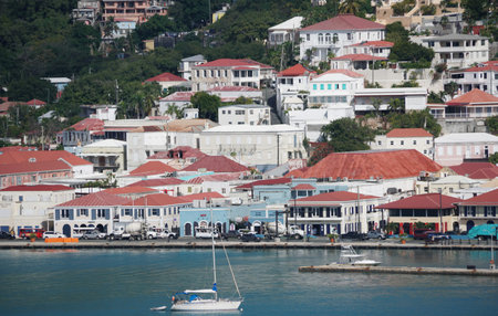 St Thomas, U.S Virgin Island - February 21, 2024 - The view of historical building with red roofs by the bayのeditorial素材