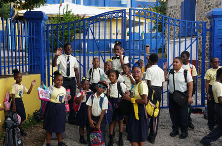 Parham Town, British Virgin Islands - February 22, 2024 - The students of Willard Wheatley Primary School waiting for their school busのeditorial素材