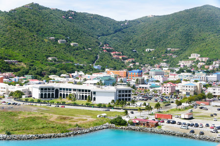 The view of the buildings in the city and traffic by the bay near Tortola, British Virgin Islands