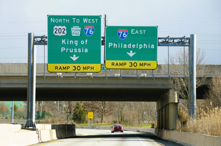Chester County, Pennsylvania, U.S.A - March 9, 2024 - Traffic and road signs into Interstate 76...