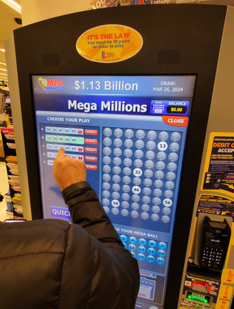 Wilmington, Delaware, U.S.A - March 26, 2024 - A person purchasing Mega Million lottery tickets...