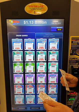 Wilmington, Delaware, U.S.A - March 26, 2024 - A person checking out the lottery tickets in front of...