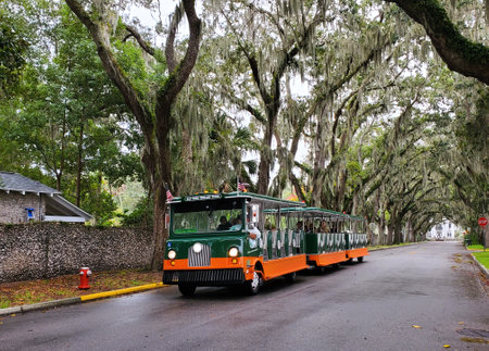 St Augustine, Florida, U.S - November 18, 2023 - The Old Town Trolley Tours moving on the streetのeditorial素材