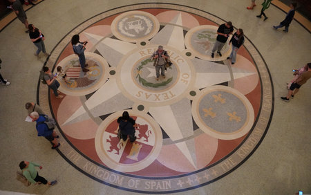 Austin, Texas, U.S - April 9, 2024 - Visitors gather on the ground floor of the Texas State Capitol...