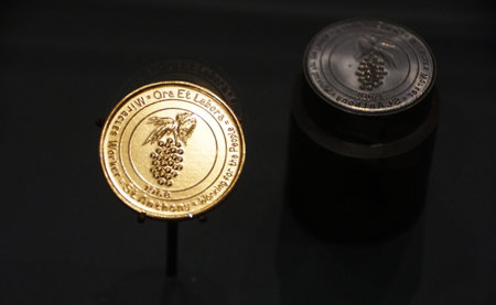 San Antonio, Texas, U.S - April 9, 2024 - The gold commemorative Hemisfair coin on display inside of the Alamo Exhibitのeditorial素材