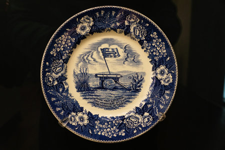 San Antonio, Texas, U.S - April 9, 2024 - The Texas Centennial Plate with Battle of Gonzales design, displayed inside of the Alamo Exhibitのeditorial素材