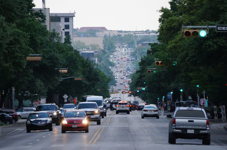 Austin, Texas, U.S.A - April 10, 2024 - The view of the traffic on Congress Avenue on a sunny dayのeditorial素材