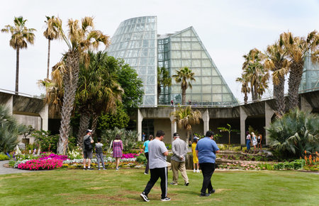 Texas, U.S.A - April 16, 2024 - Visitors walking on the outside gardens in the San Antonio Botanical Gardenのeditorial素材