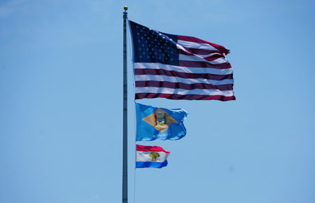 Rehoboth Beach, Delaware, U.S - June 23, 2024 - A flag pole with American flag, Delaware flag and Sussex County flagのeditorial素材