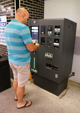 Philadelphia, Pennsylvania, U.S.A - June 19, 2024 - A man using the new Hub machine by Philadelphia...