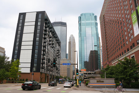 Minneapolis, Minnesota, U.S.A - July 9, 2024 - The view of the tall buildings, hotels and traffic on S 11th Street on a sunny dayのeditorial素材