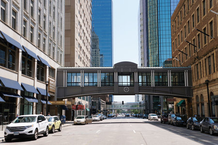 Minneapolis, Minnesota, U.S.A - July 9, 2024 - The view of the tall buildings, Skyway bridge, hotels and traffic near Nicollet Mall area on a sunny dayのeditorial素材