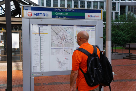 Minneapolis, Minnesota, U.S.A - July 12, 2024 - A visitor is reading the map on the information...