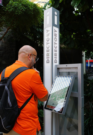 Minneapolis, Minnesota, U.S - July 12, 2024 - A visitor reading the electronic directory inside of...