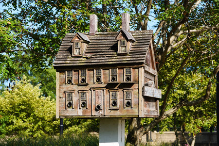 The wooden birdhouse on a white pedestal displayed near Wilmington Riverwalk, Delaware, U.S.Aの写真素材