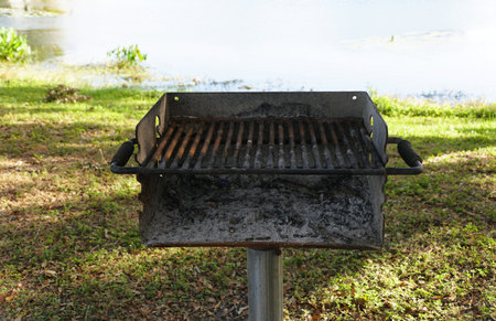 Closeup of an empty charcoal grill, ready for a summer cookout.