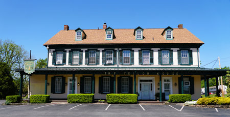 The Yellow House, a historical hotel and restaurant, boasts a well-maintained facade near Douglassville, Pennsylvania, U.S.Aの写真素材