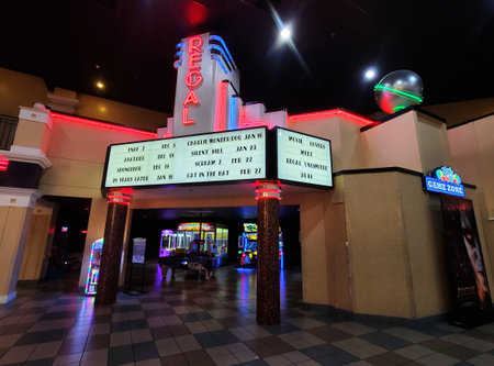 Wilmington, Delaware, U.S.A - Nov 30, 2025 - The Regal Cinema entrance to the video game arcade, features neon marquee with movie release datesのeditorial素材