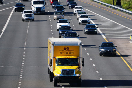 Orlando, Florida, U.S.A - Nov 28, 2025 - The Baltic Movers truck navigates multi-lane highway during...