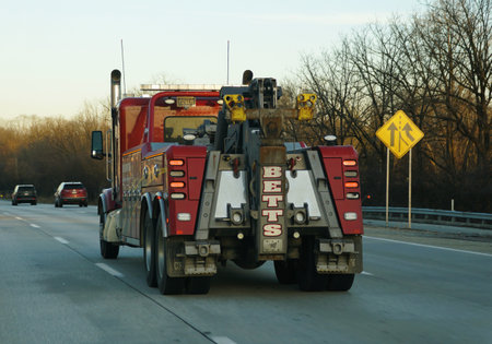 Pennsylvania, U.S.A - Dec 24, 2025 - BETTS tow truck on highway equipped with towing gear and safety...