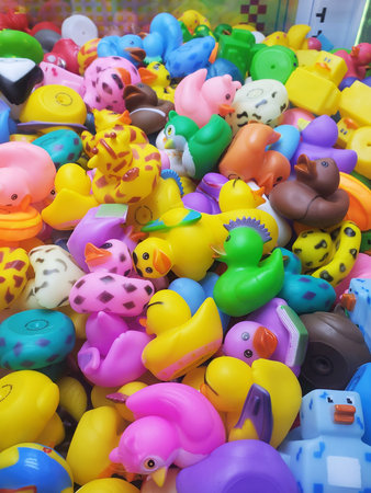 Pennsylvania, U.S.A - Dec 26, 2025 - Colorful rubber ducks with playful designs fill a claw machine,...