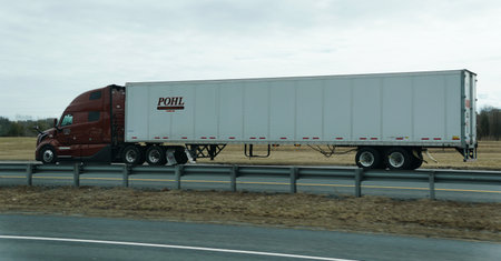 New Jersey, U.S.A - Feb 21, 2026 - A maroon long-haul semi-truck transporting freight along the...