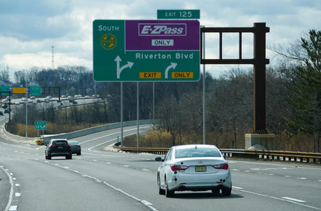 New Jersey, U.S.A - Feb 21, 2026 - Overhead signs direct drivers toward Parkway South, E-ZPass...