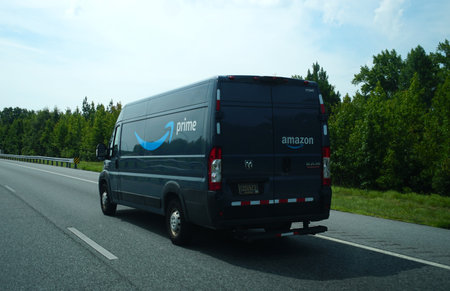 Delaware, U.S.A - Aug 1, 2026 - An Amazon Prime delivery van traveling on the highway, showcasing Prime branding