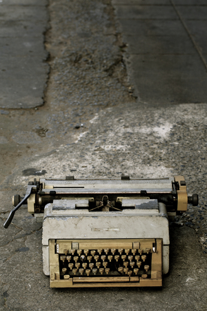 Ancient typewriter used in unsanitary conditions.の写真素材