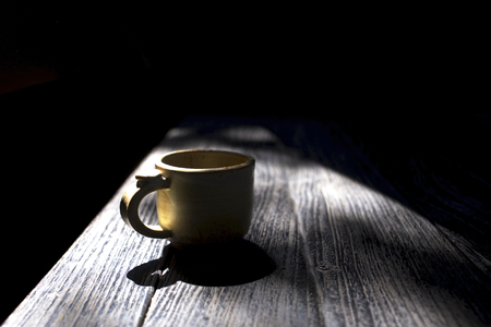 Cup of coffee with shadowの写真素材
