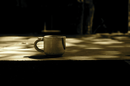 Cup of coffee with shadowの写真素材