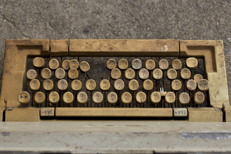 Ancient typewriter used in unsanitary conditions.の写真素材